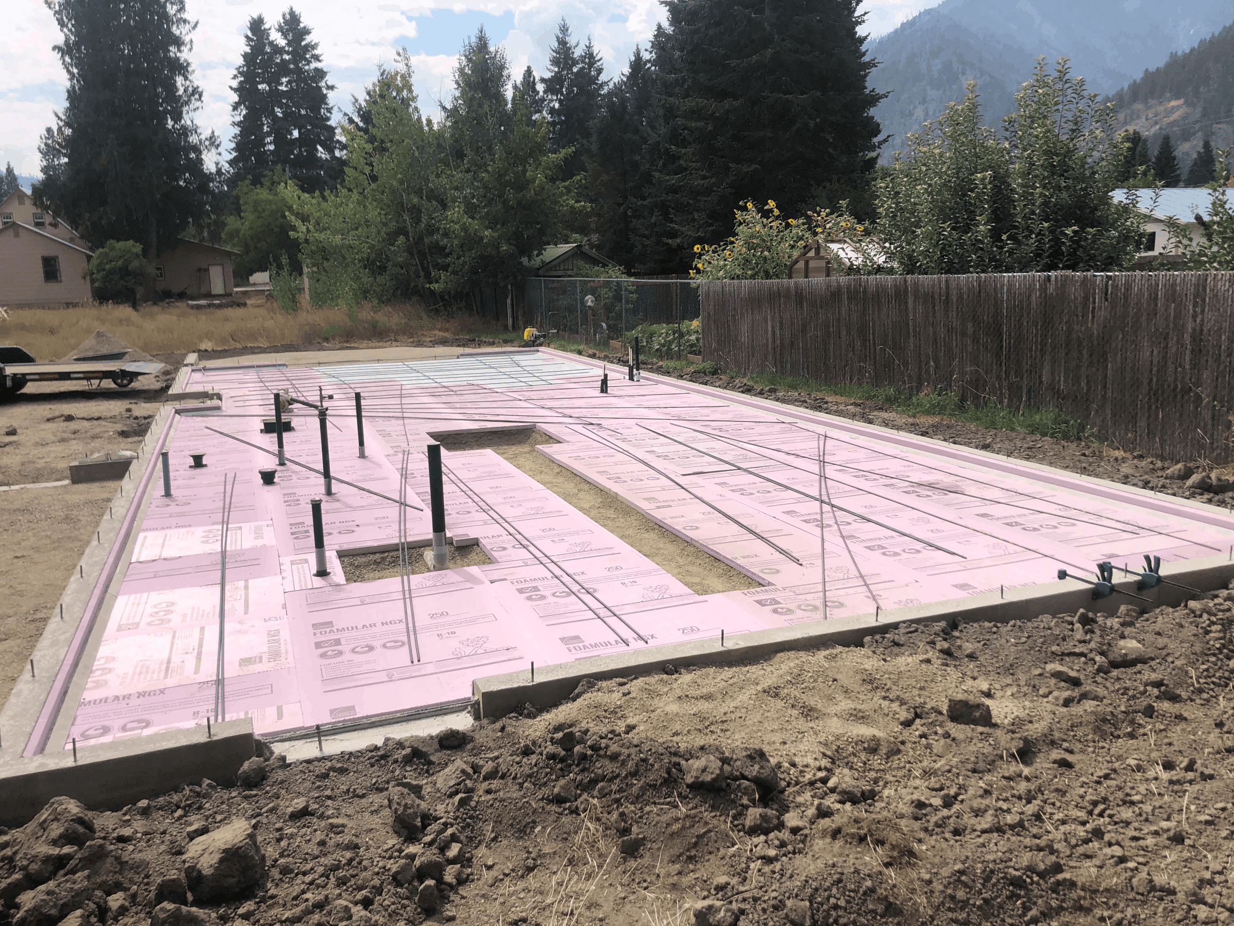 Foundation, footings and insulation ready for concrete pad pour for a residential home