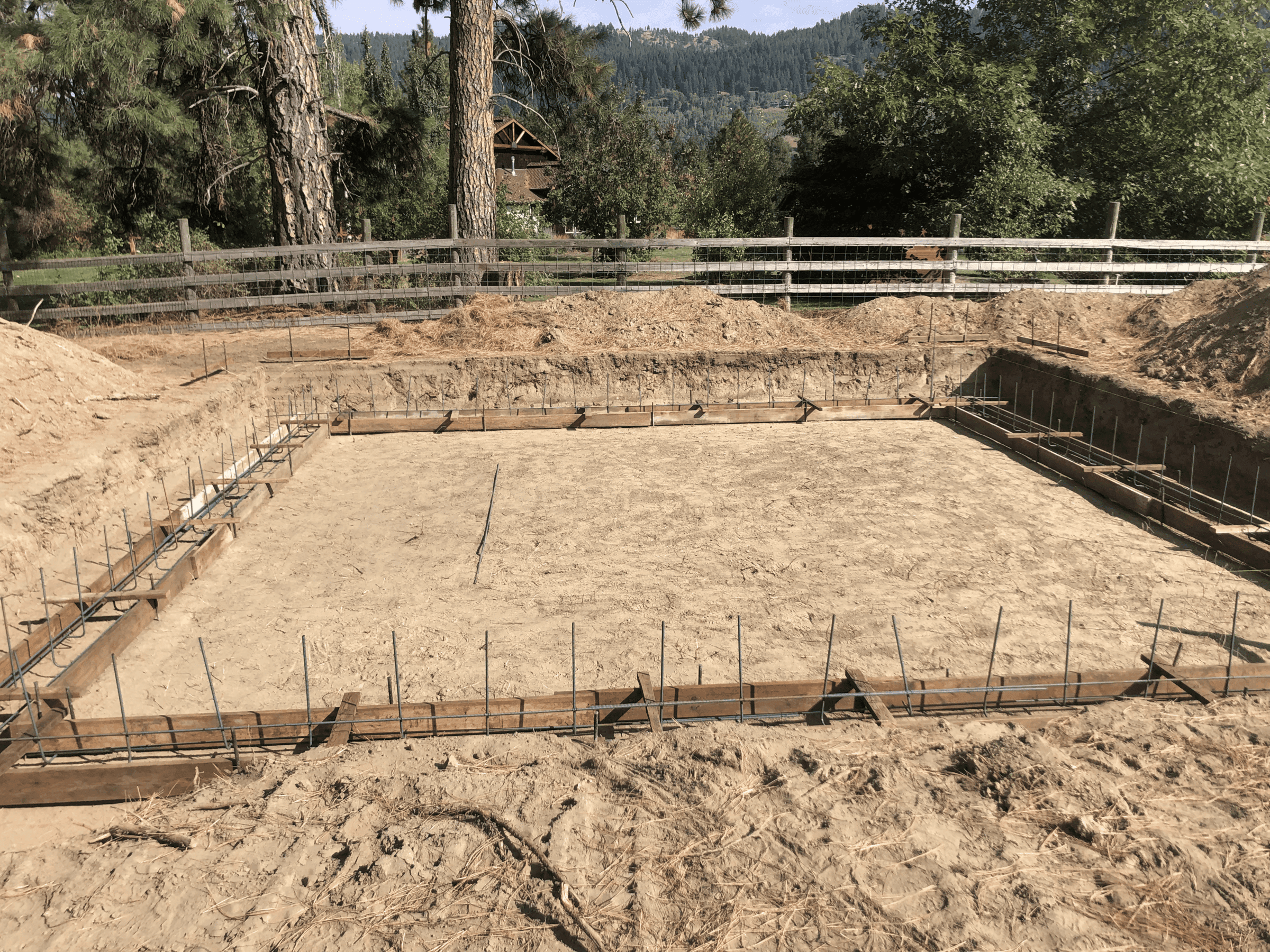 Foundation dug for a residential home with boards placed ready for concrete pour
